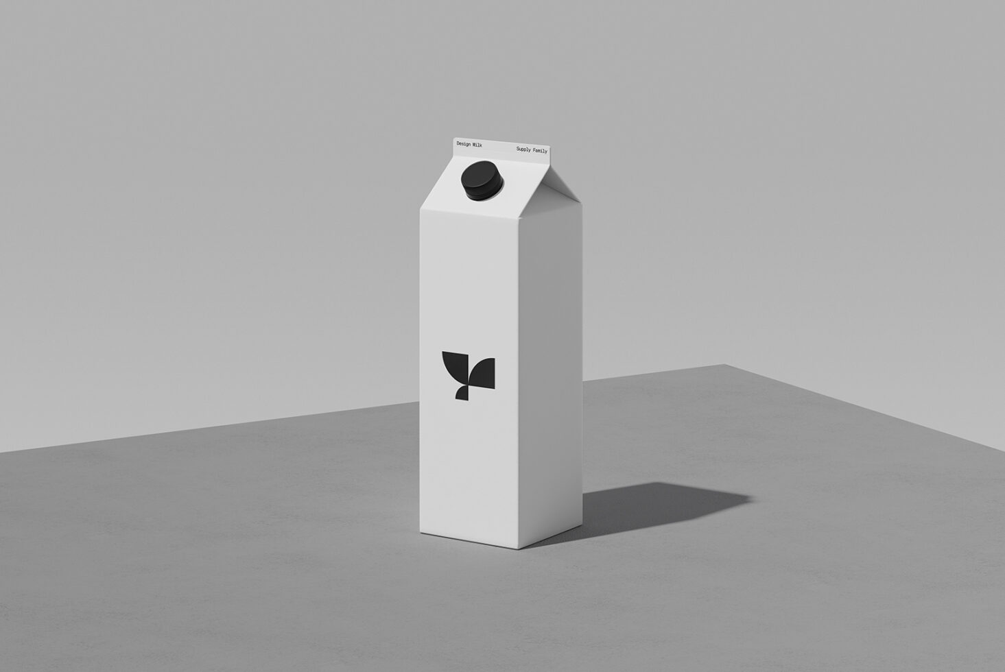 Milk carton mockup with black cap, leaf logo, clean minimal design on gray surface