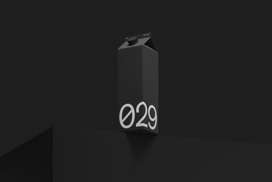 Black milk carton mockup with 029 number on front against dark background
