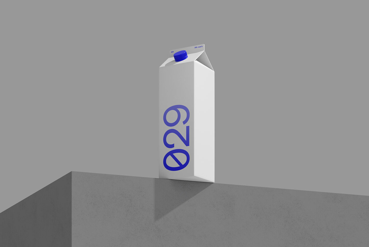 Milk carton mockup with blue cap sitting on concrete ledge, minimalist gray background