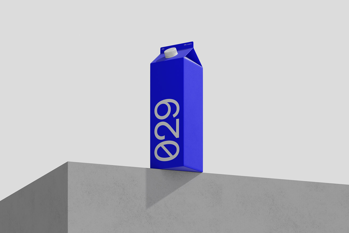 Bright blue milk carton mockup with gold numbers on concrete platform, neutral background