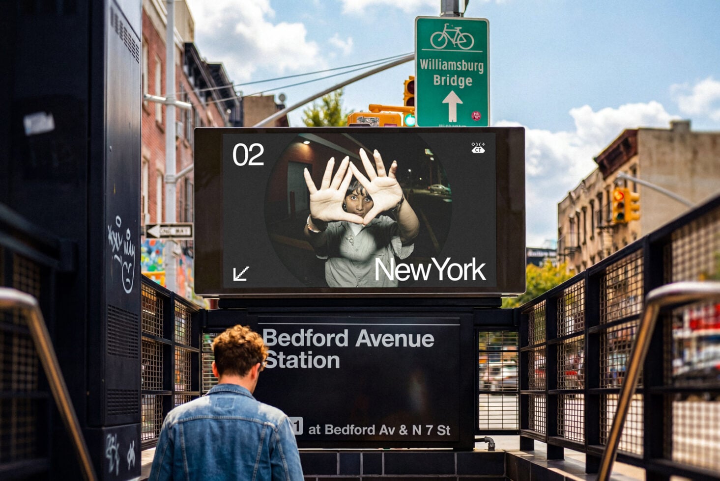 Digital billboard showing person making heart gesture with New York text
