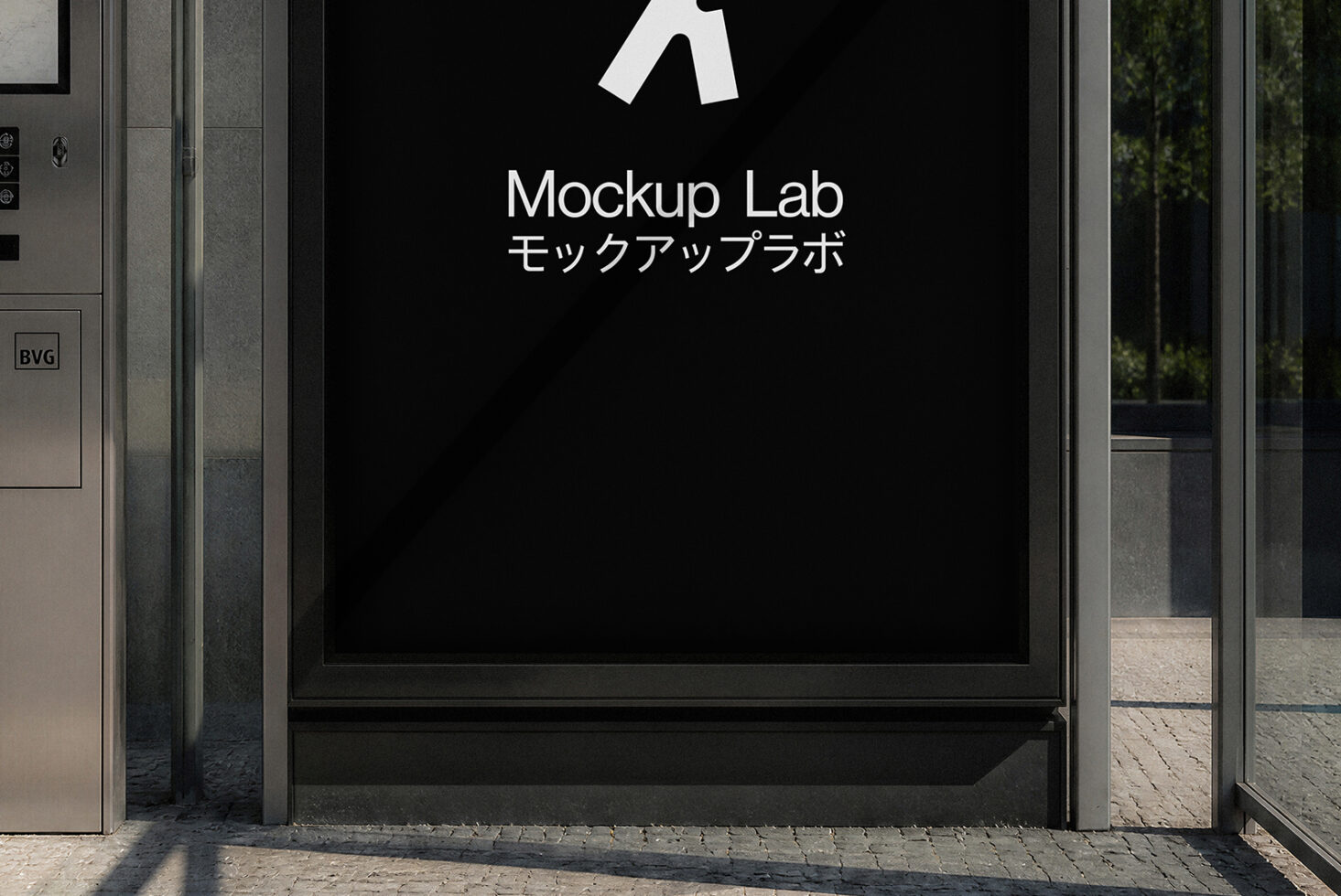 Storefront window display with Mockup Lab logo on black screen, metal frame, concrete exterior