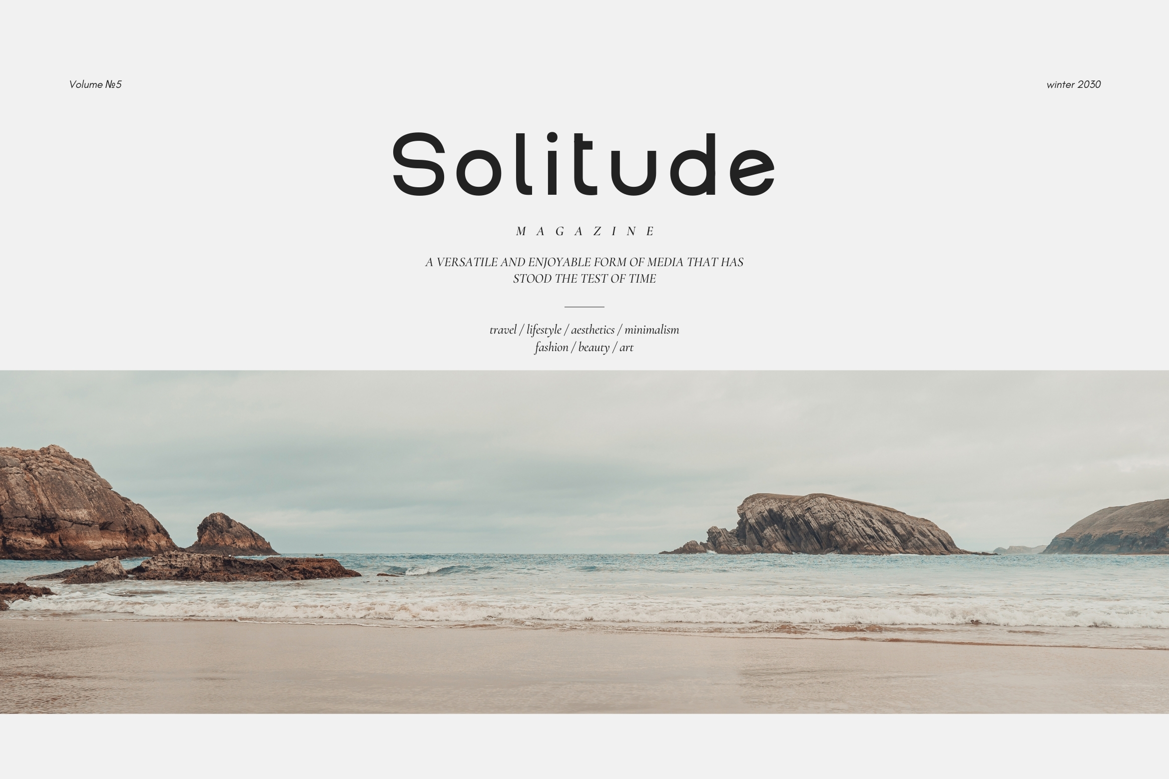 Solitude magazine cover with rocky beach landscape, minimalist typography layout