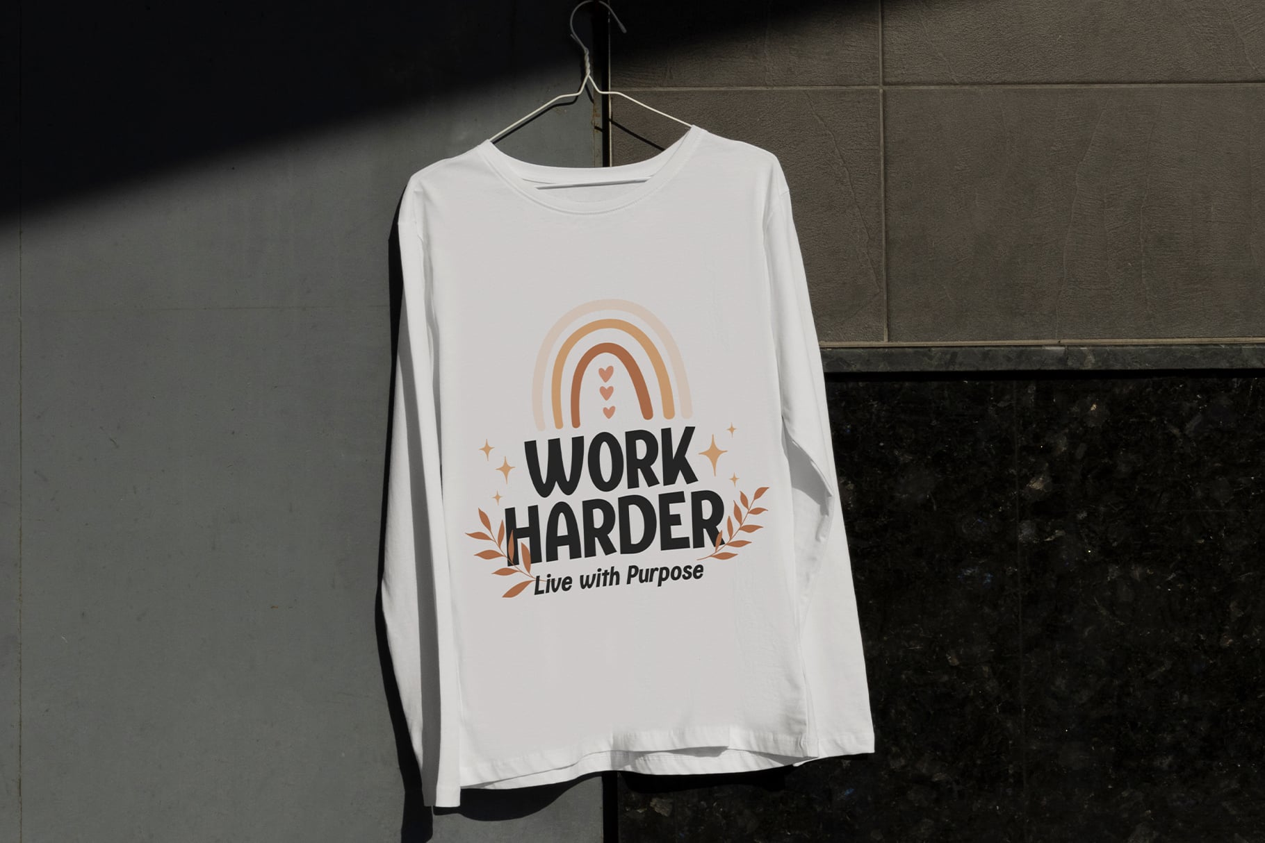 White long sleeve tee on hanger with Work Harder Live with Purpose graphic design