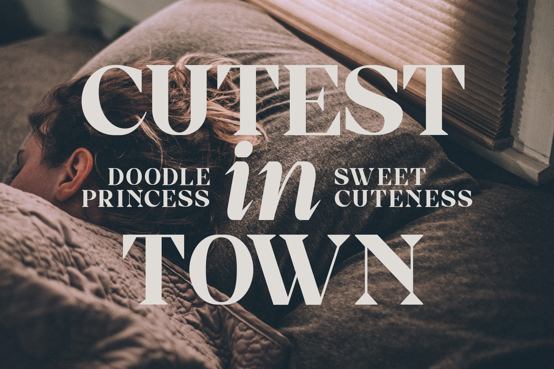 Cutest In Town serif font displayed over cozy fabric with doodle princess tagline