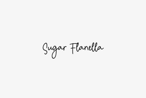 Sugar Flanella handwritten script font in minimal black on light beige