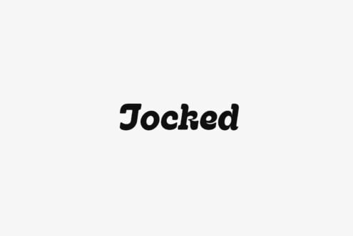 Jocked black serif typeface rendered centered on light gray background