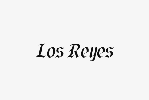 Los Reyes serif font in italicized script style