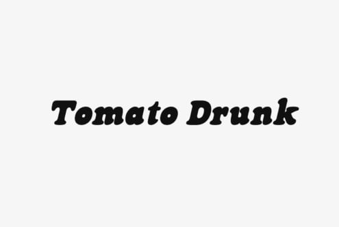 Tomato Drunk bold slab serif font in black on light background