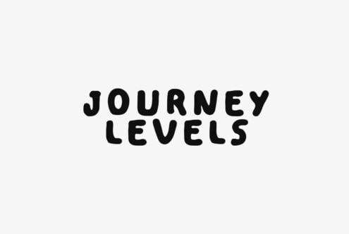 Black sans serif text on white background saying Journey Levels
