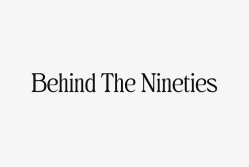 Behind The Nineties text in elegant serif font centered on light neutral background