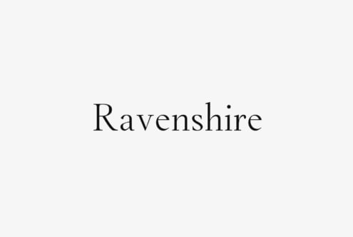 Ravenshire serif font displayed in elegant black lettering on light gray background