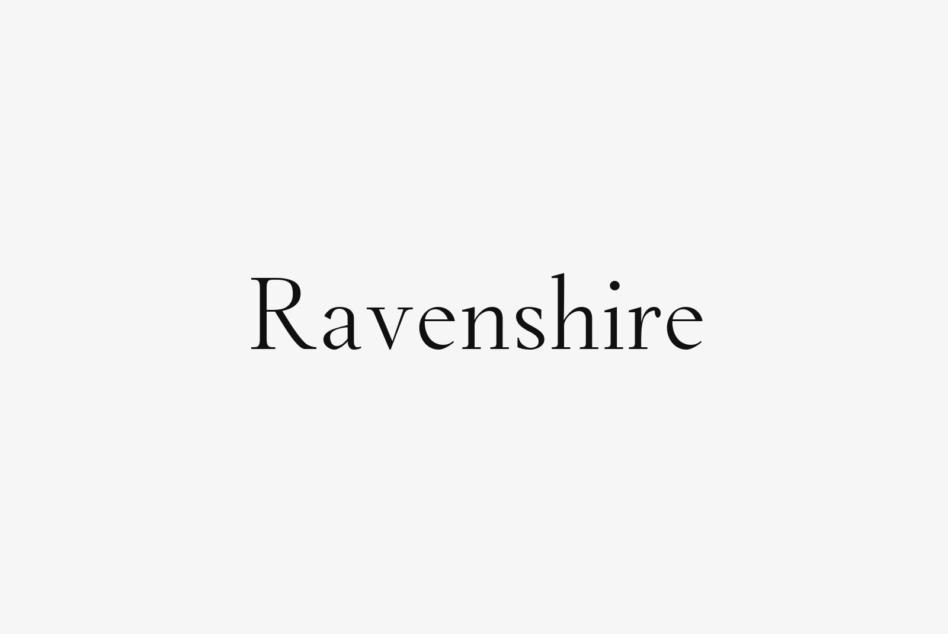 Ravenshire serif font displayed in elegant black lettering on light gray background