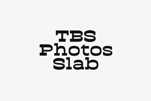 Bold serif font spelling out TBS Photos Slab on light background