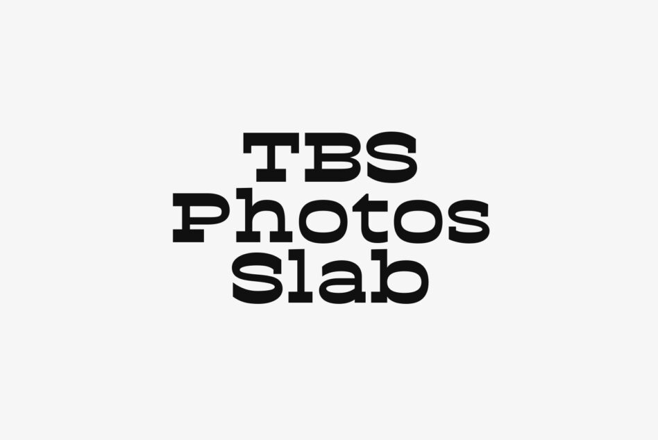 Bold serif font spelling out TBS Photos Slab on light background