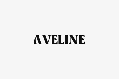Aveline serif typeface in bold black letters centered on cream background