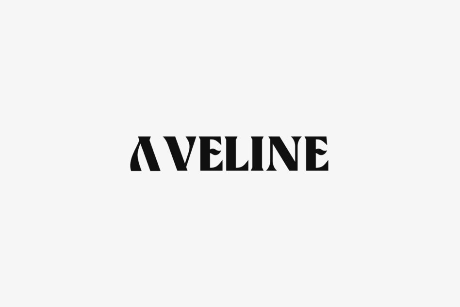Aveline serif typeface in bold black letters centered on cream background