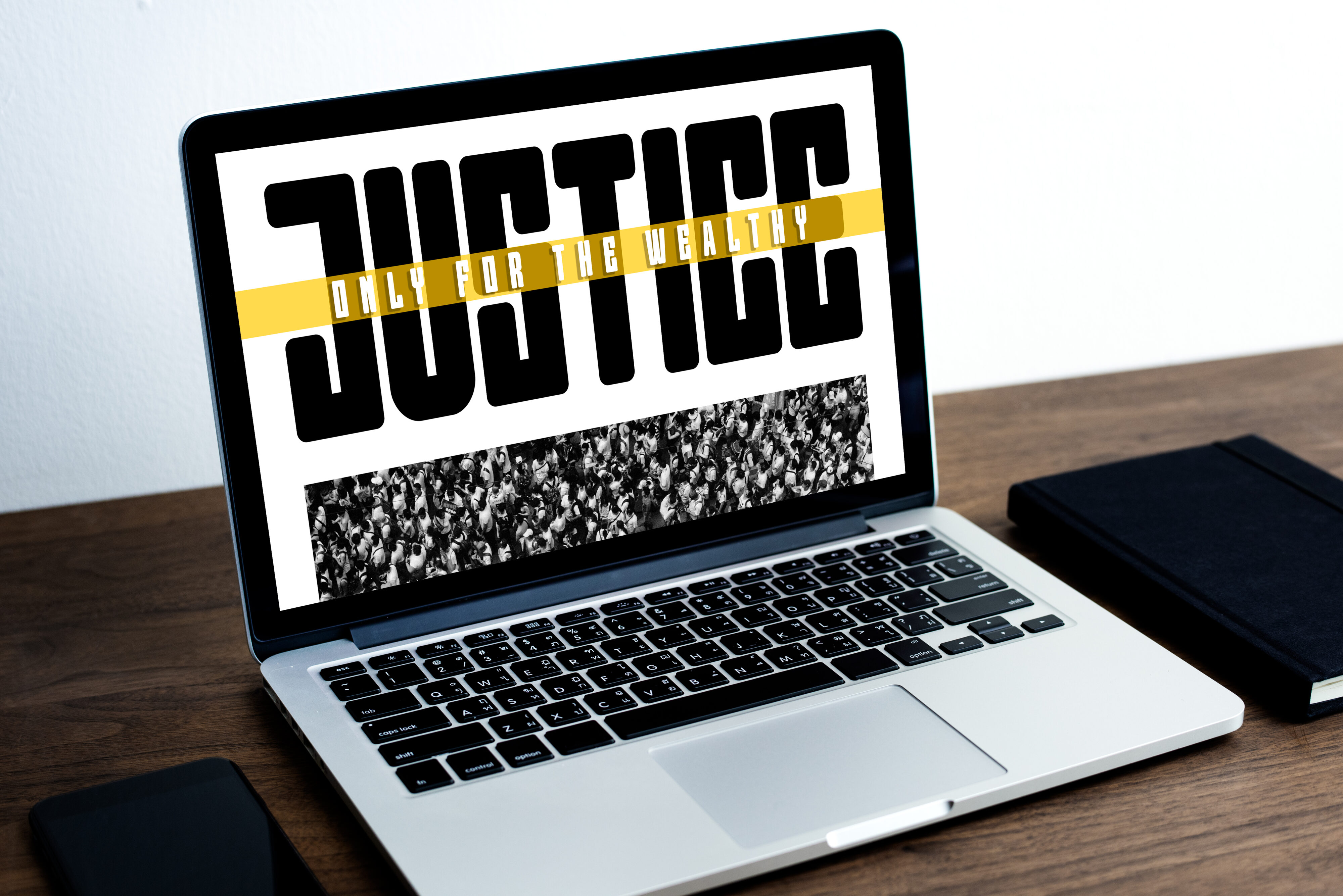 Laptop showing quotation design with bold black text, yellow stripe