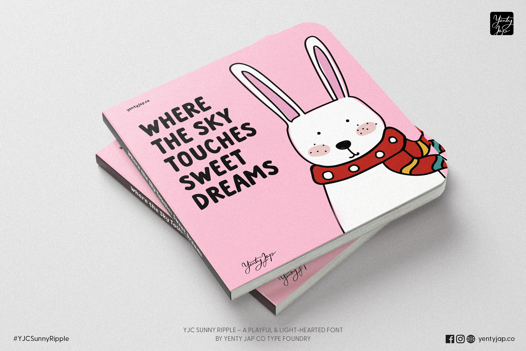 Stacked pink hardcover books with bunny wearing red polka dot sweater on cover