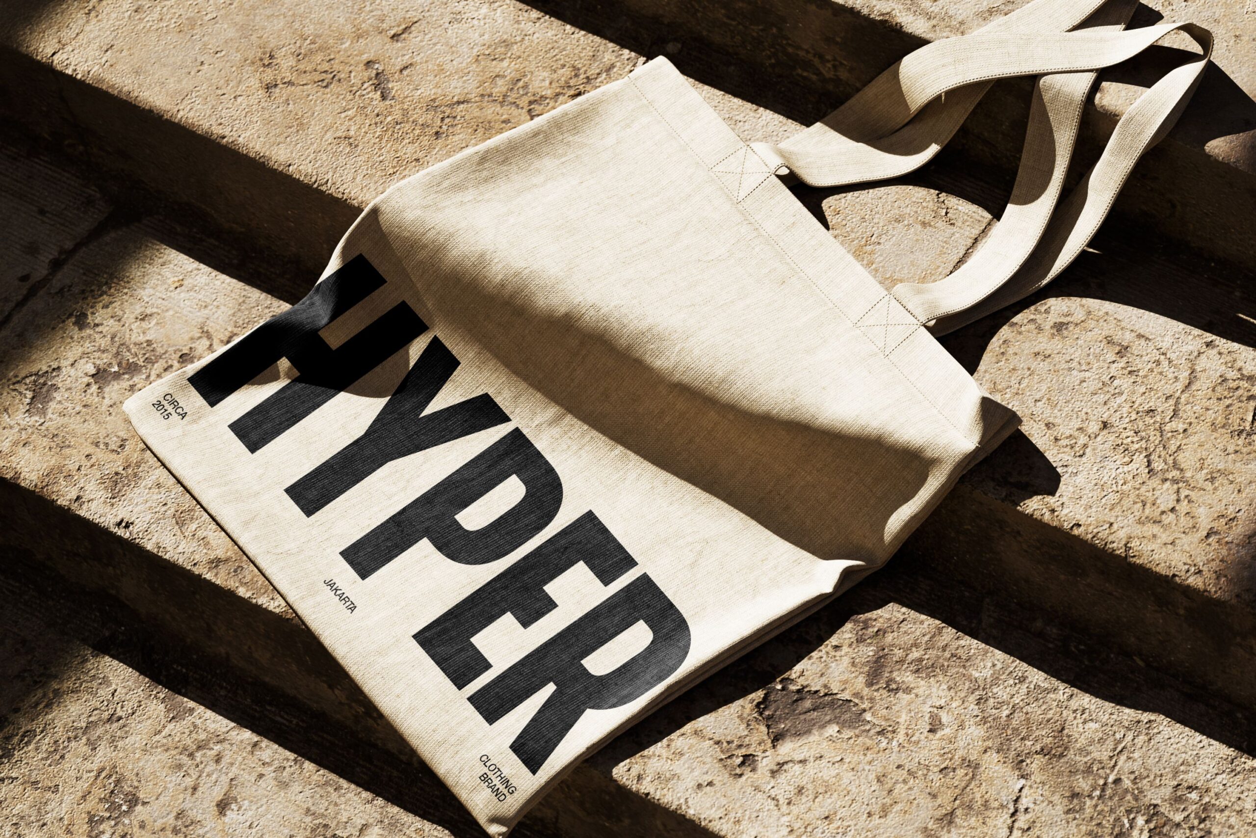 Canvas tote bag mockup with HYPER text in bold black letters