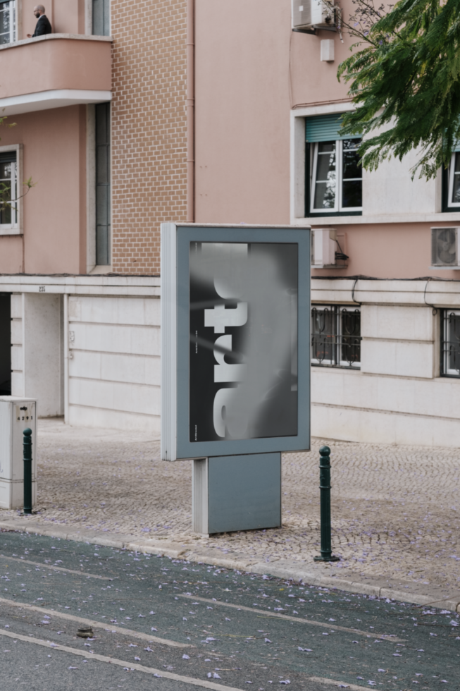 Street billboard mockup on urban sidewalk with pink building backdrop