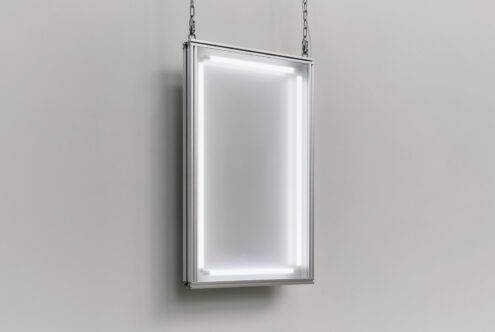 Hanging lightbox mockup with chrome frame showing glowing white interior on neutral background