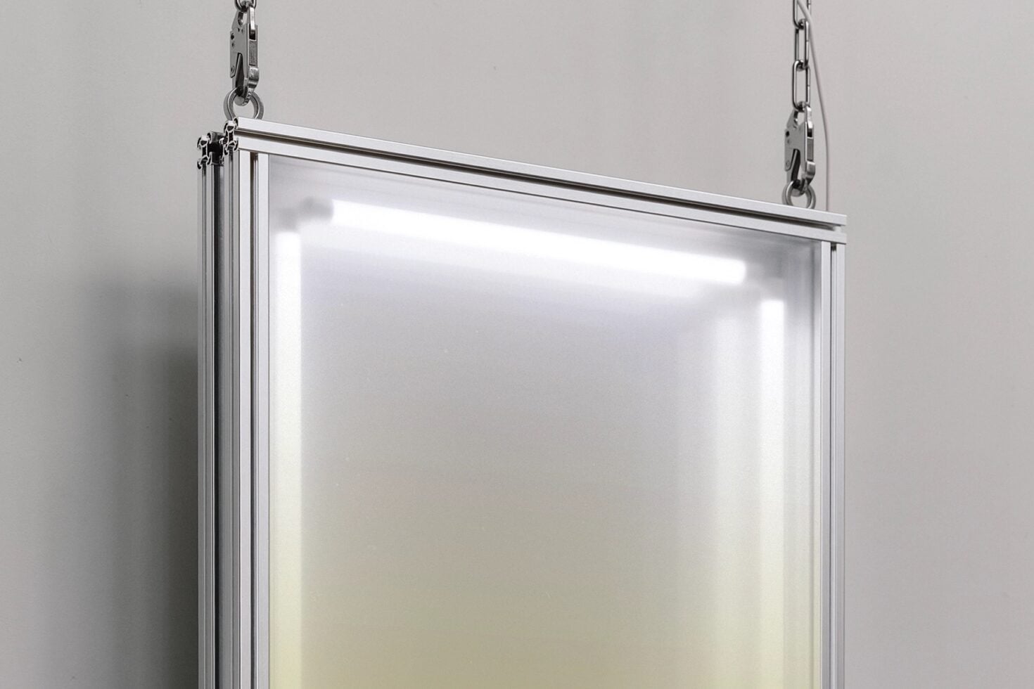 Hanging metal frame lightbox with glowing white display, ready for your text or design