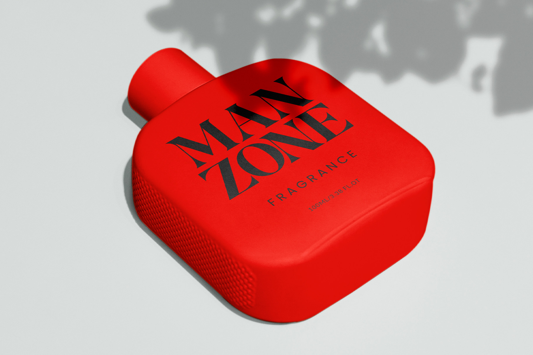 Red heart shaped fragrance bottle mockup with black geometric logo on side