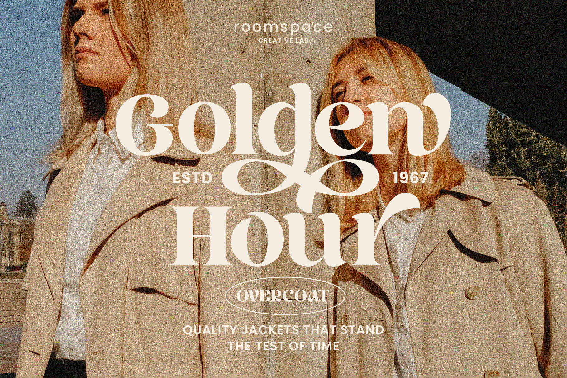 Fashion ad mockup showcasing two models in trench coats with bold vintage typography Golden Hour perfect for branding and marketing designers.