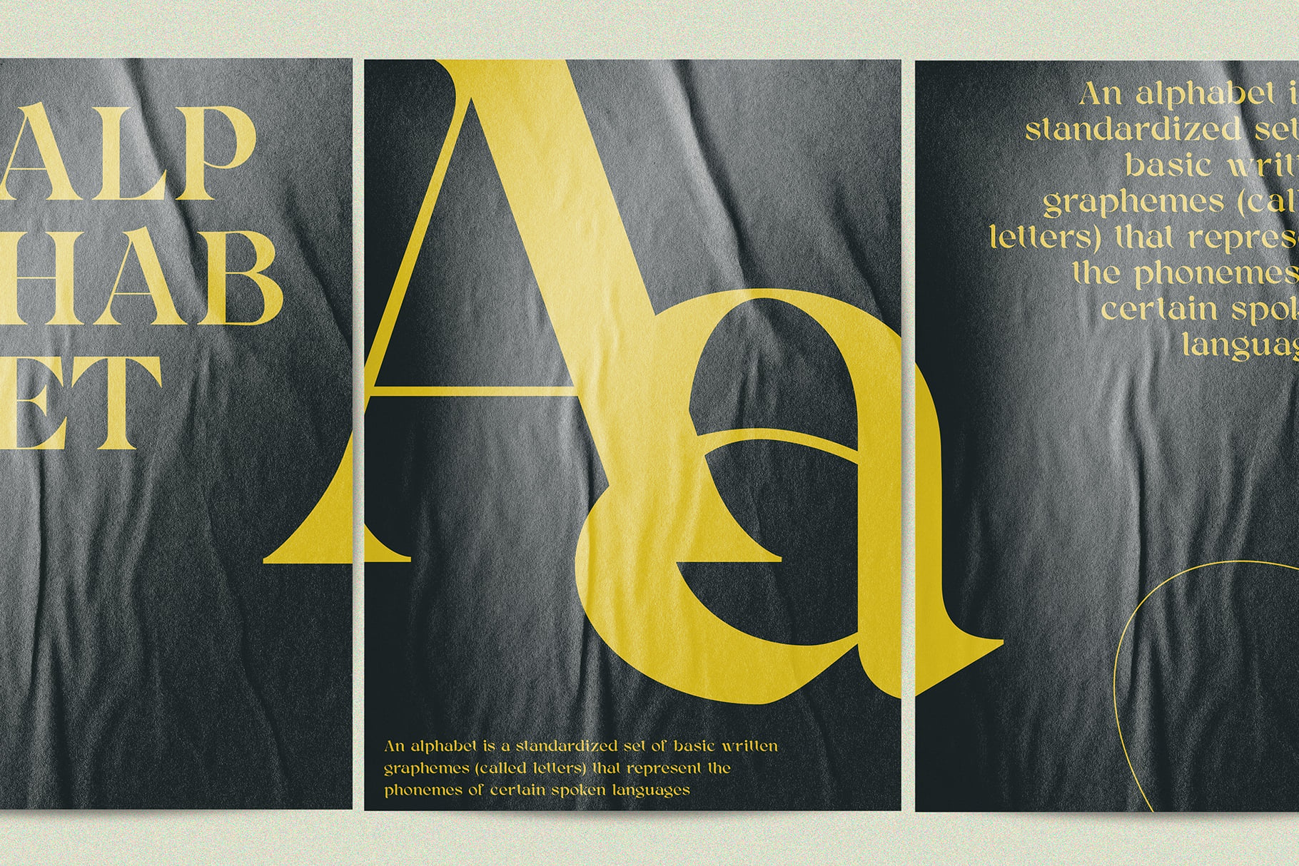 Yellow capital letters A through Q on draped gray fabric with definition text