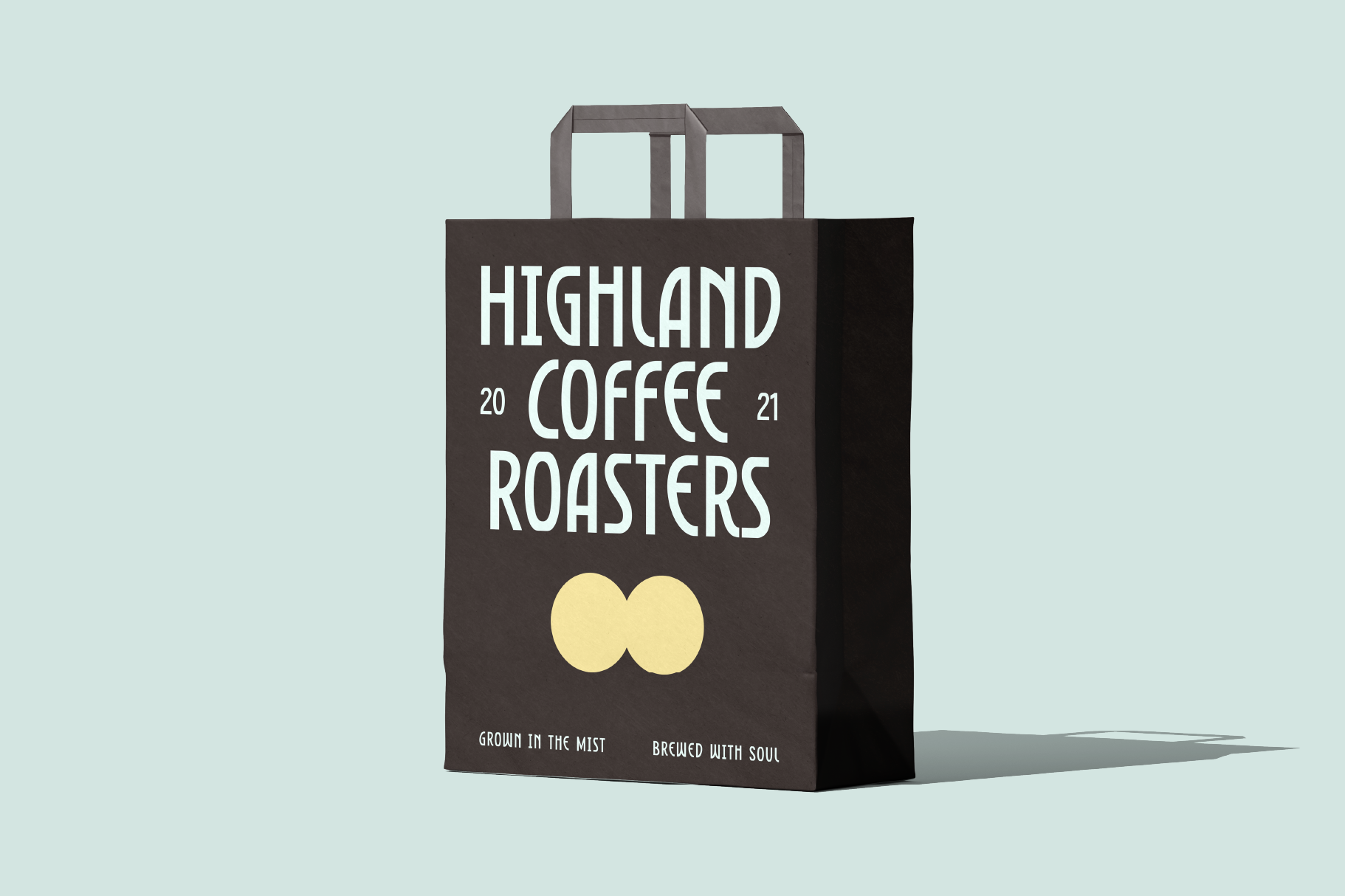 Brown paper shopping bag mockup for Highland Coffee Roasters with yellow circles