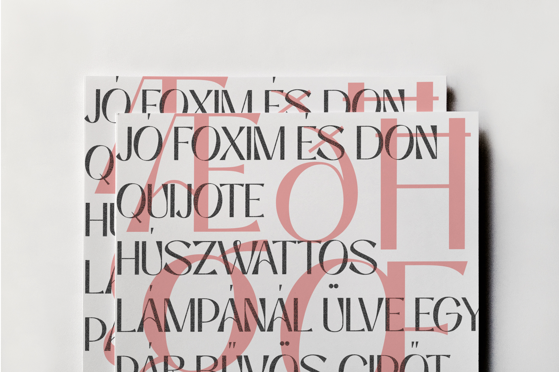 Overlapping cream paper sheets with black serif text in Hungarian, dusty rose geometric shapes layered throughout