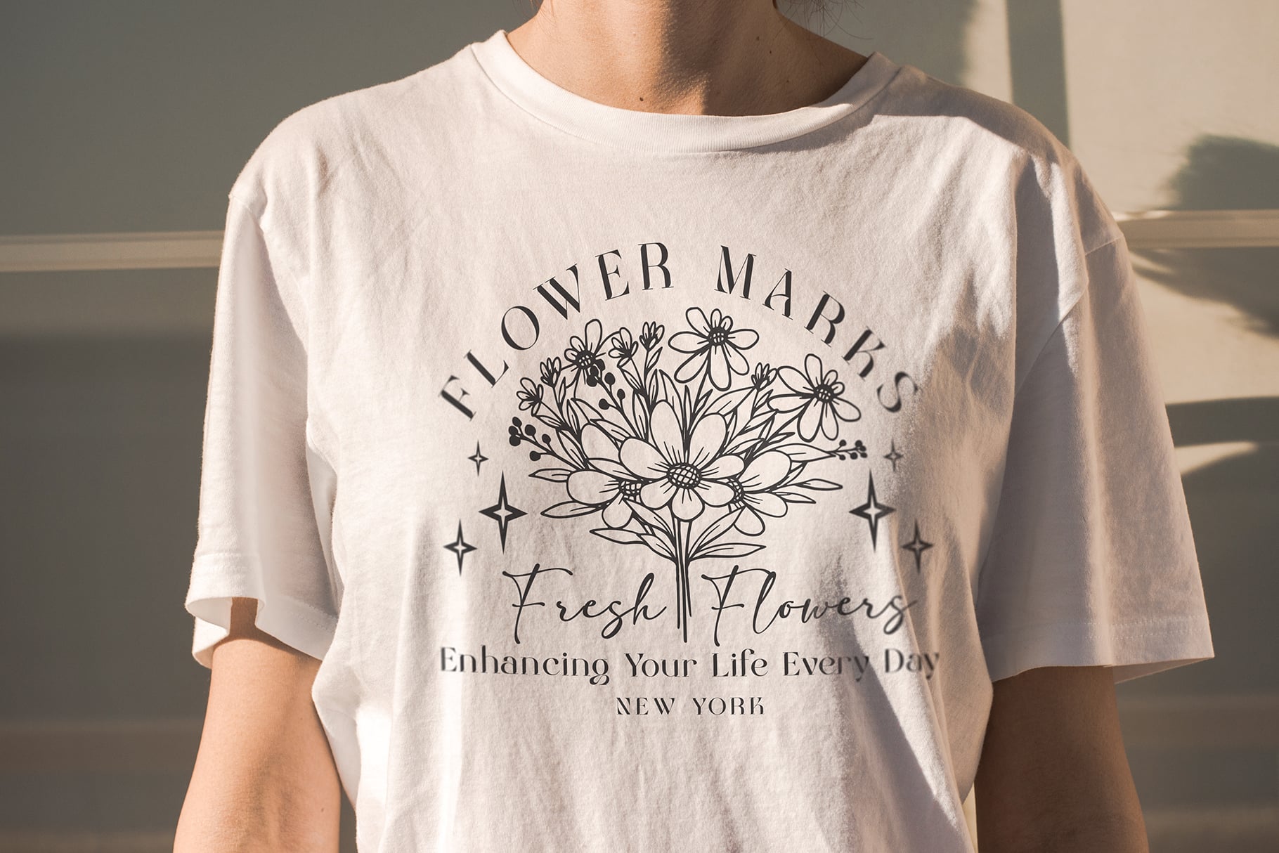 Cream tee with Flower Markt Fresh Flowers graphic, floral line art design centered