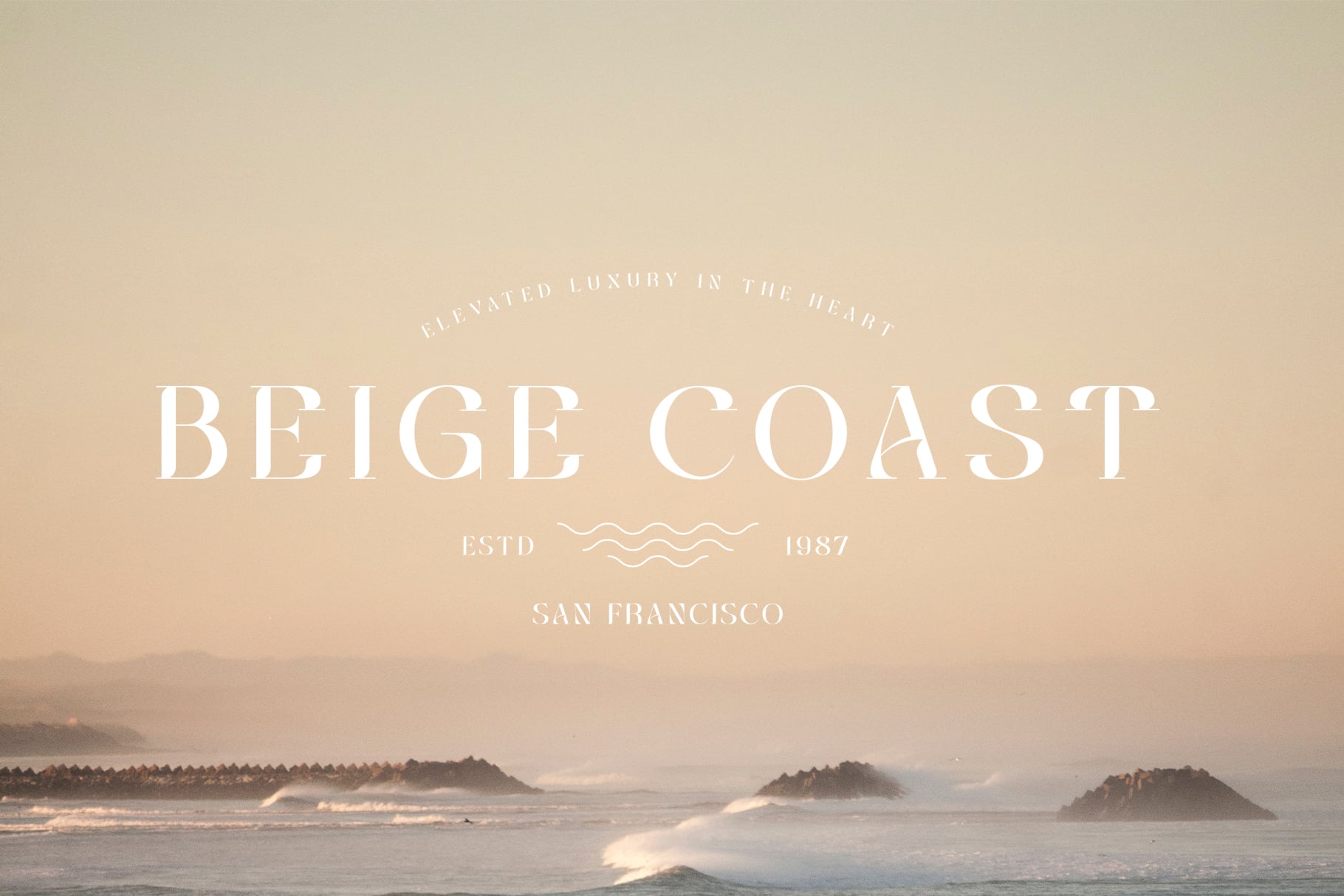 Beige Coast luxury branding displayed over misty ocean waves, San Francisco