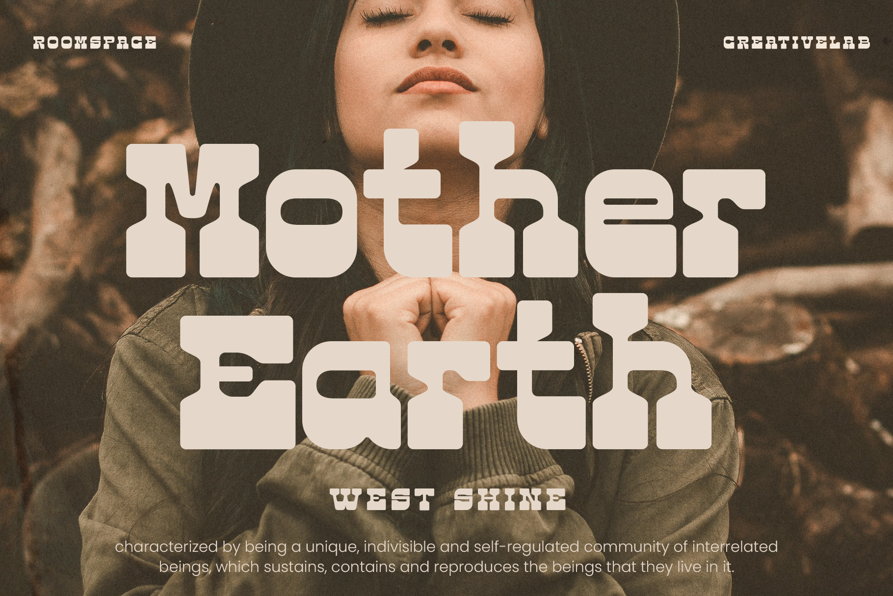 Girl in olive jacket with closed eyes holding hands to chest with Mother Earth typography