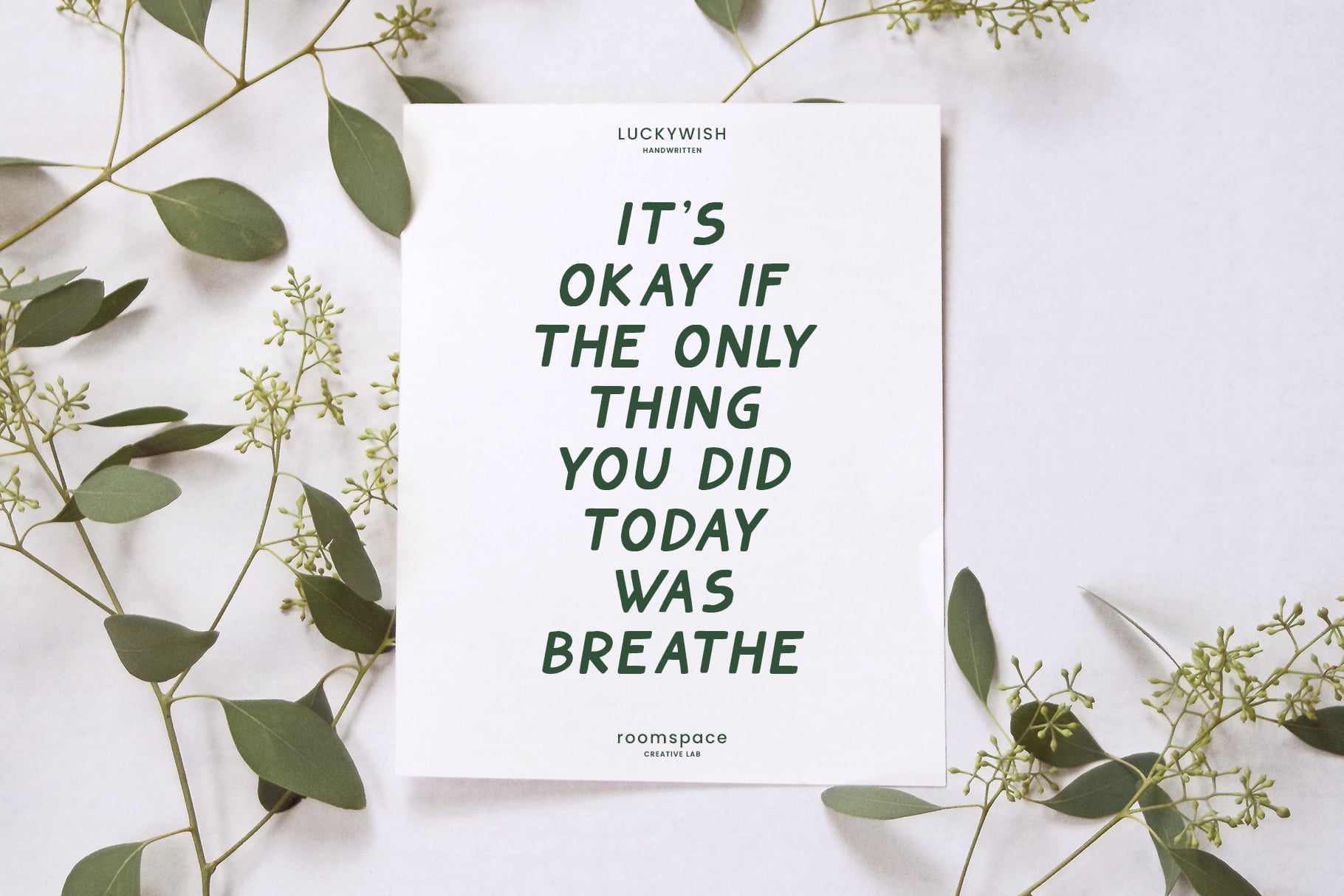 White card surrounded by green branches reads It's Okay if Only Thing You Did Today Was Breathe