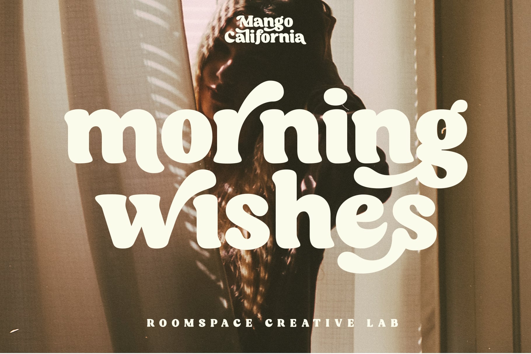 Morning Wishes text overlaid on warm-toned portrait photo with creative lab credit
