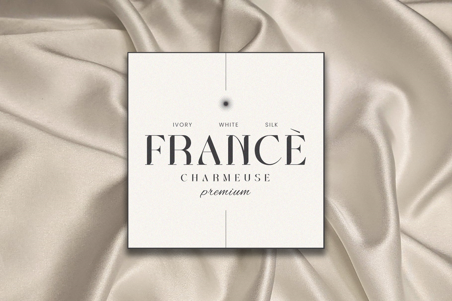 France Charmeuse premium fabric label on ivory silk textile background