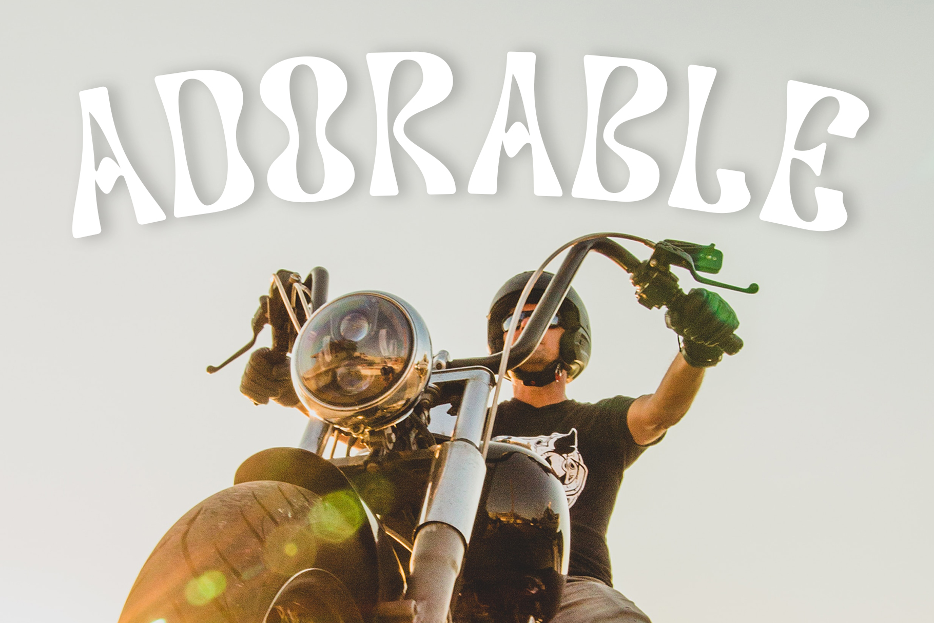 Adsorbage font layered over motorcyclist headlight image