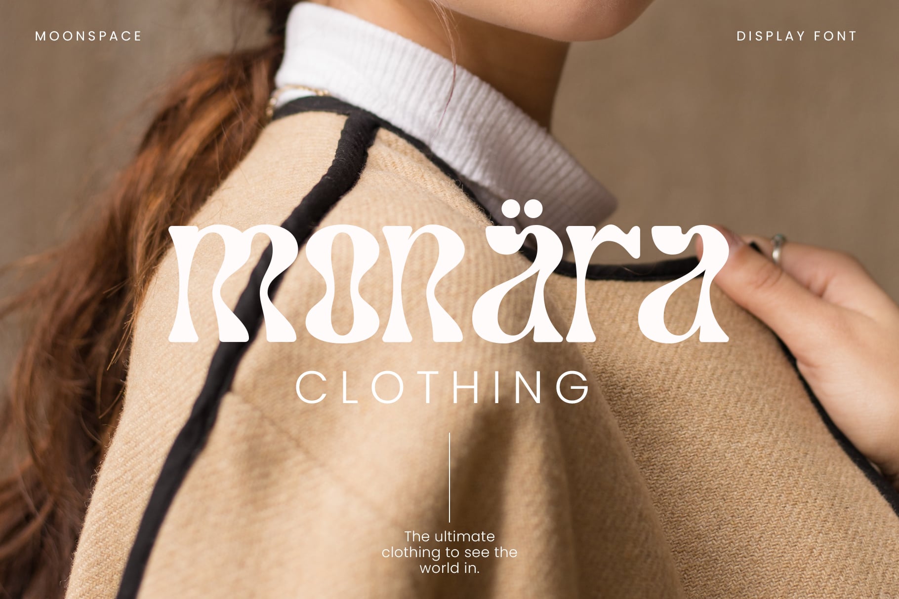 Moonspace font on beige sweater with tagline below