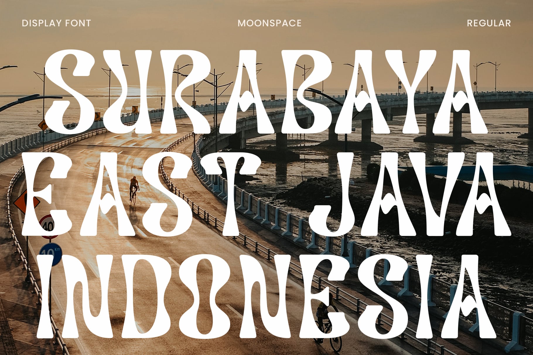 Moonspace font displayed over pier with cyclist photo overlay