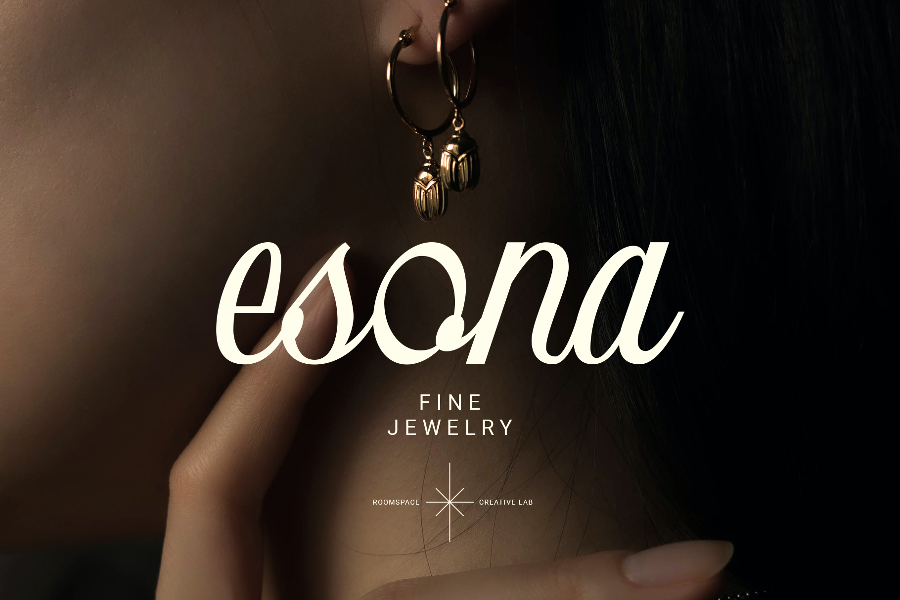 Fine jewelry branding with Esona script typeface over gold earring photo
