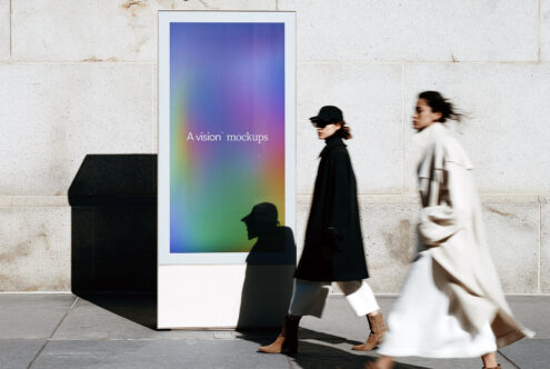 Outdoor digital screen mockup with rainbow gradient, people passing in front of weathered wall