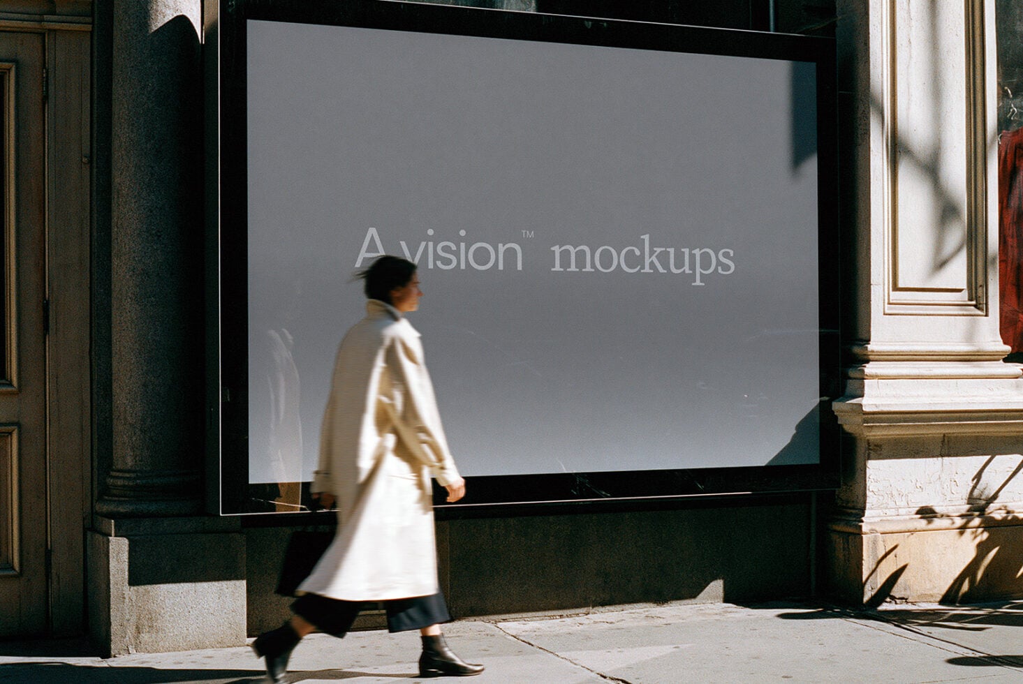 Large storefront window mockup with person walking past in cream coat