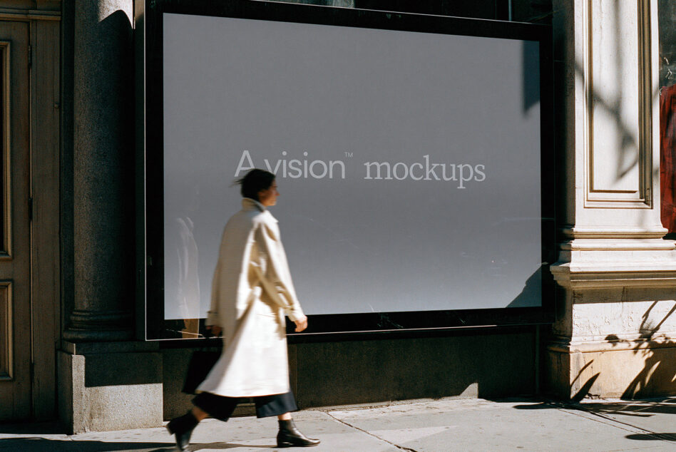 Large storefront window mockup with person walking past in cream coat