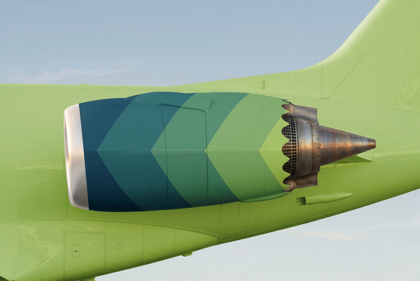 Lime green fuselage showing teal to green gradient chevron stripe on engine