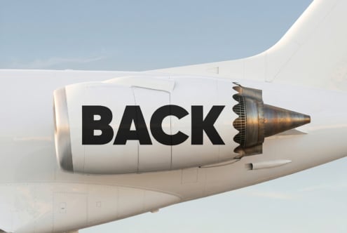 White jet engine nacelle with bold BACK text printed across the side