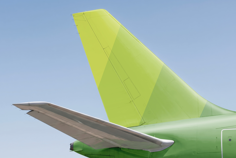 Lime yellow green aircraft vertical stabilizer with riveted seams