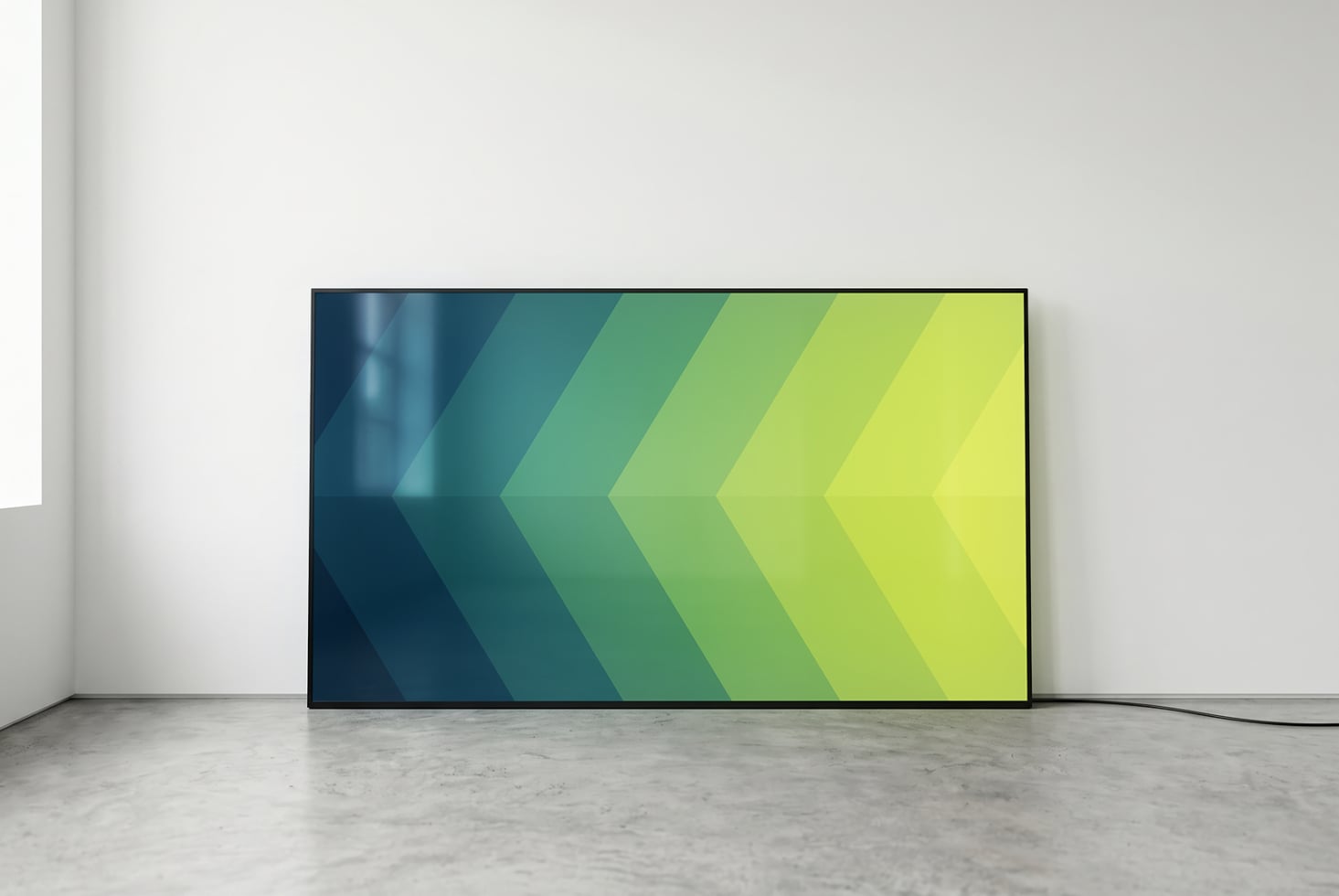 Monitor showing teal to lime gradient arrow pattern chevrons