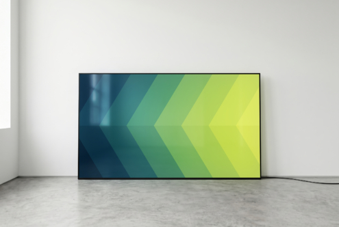 Monitor showing teal to lime gradient arrow pattern chevrons